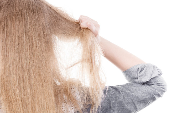 Woman pulling hair out