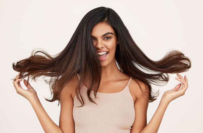 Woman with black hair and thick hair texture